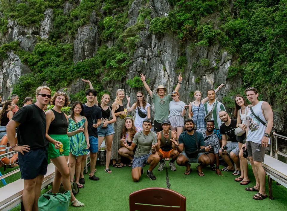 A small group of guests on a boat deck in Lan Ha Bay
