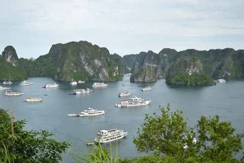 Cruise boats moored among the karst islands of Ha Long Bay