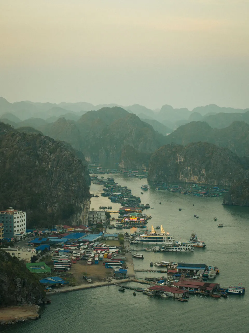Misty morning over Cat Ba harbour and the limestone islands of Lan Ha Bay