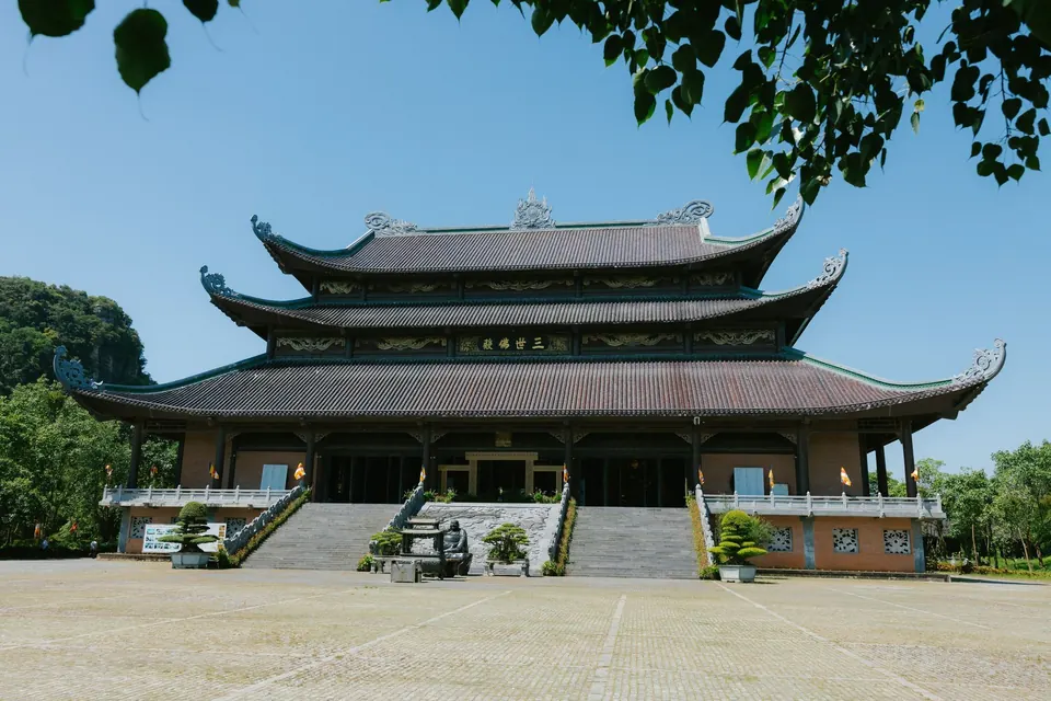 The main hall of Bai Dinh Pagoda in Ninh Binh under a clear blue sky