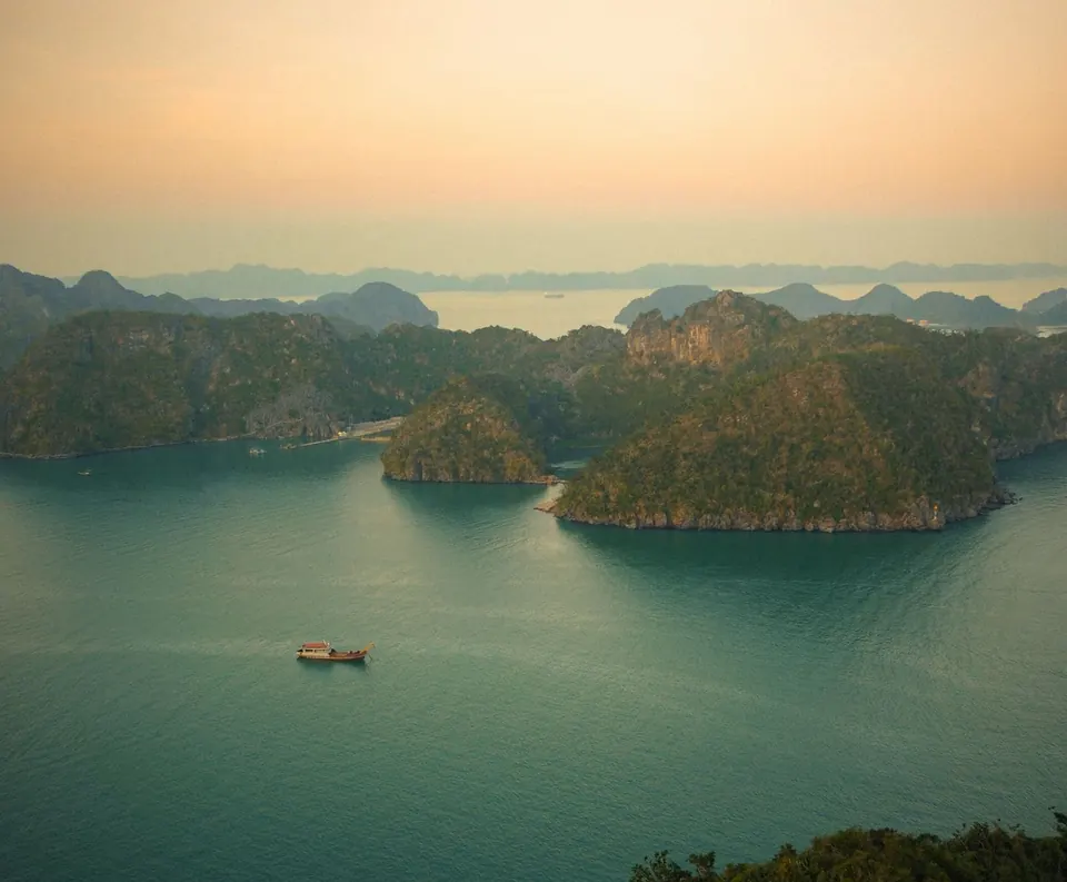 Lan Ha Bay at golden hour seen from a hilltop above Cat Ba